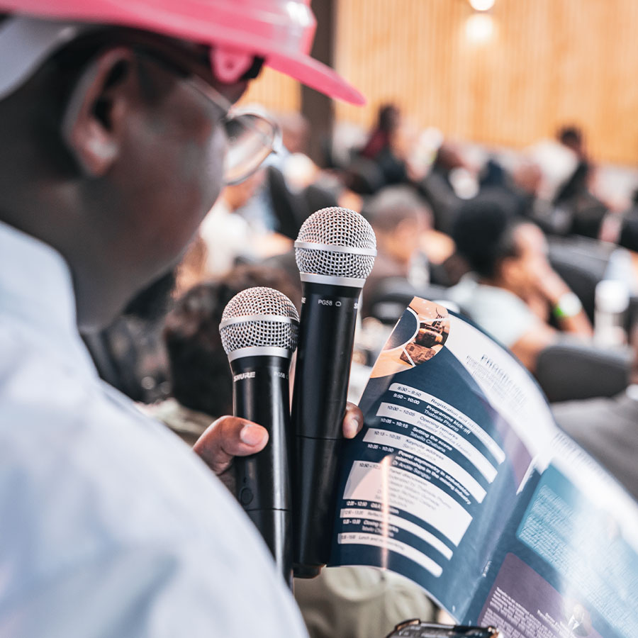 MC with Microphone at Conference
